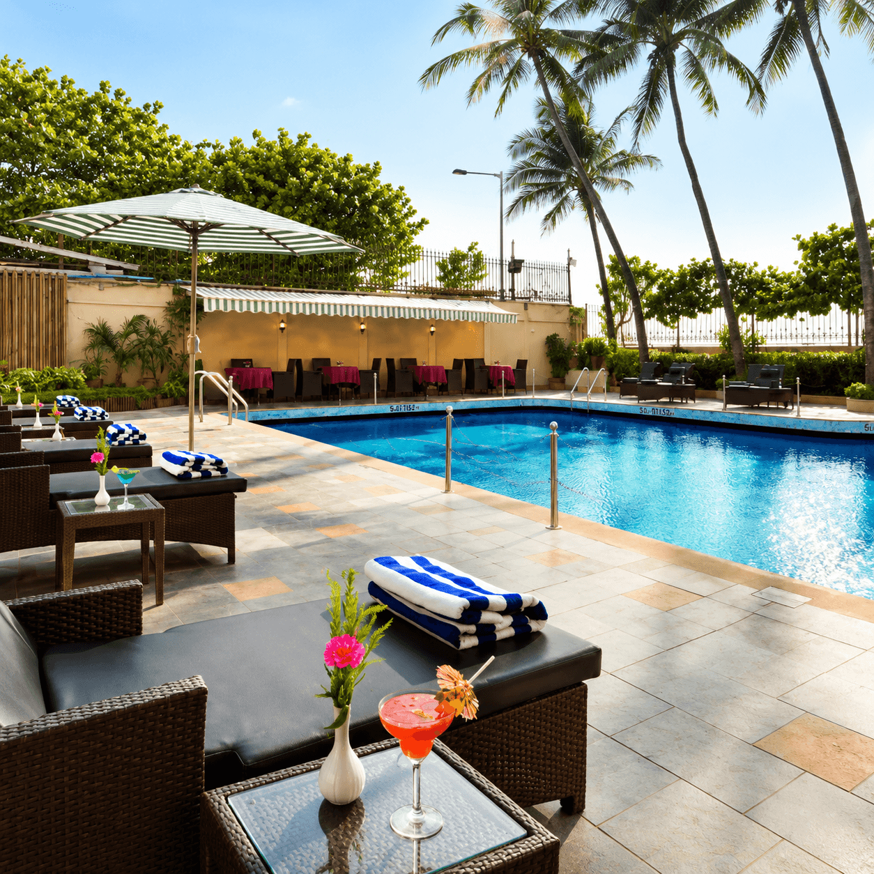 Poolside Patio at Ramada Plaza by Wyndham Palm Grove  Juhu
